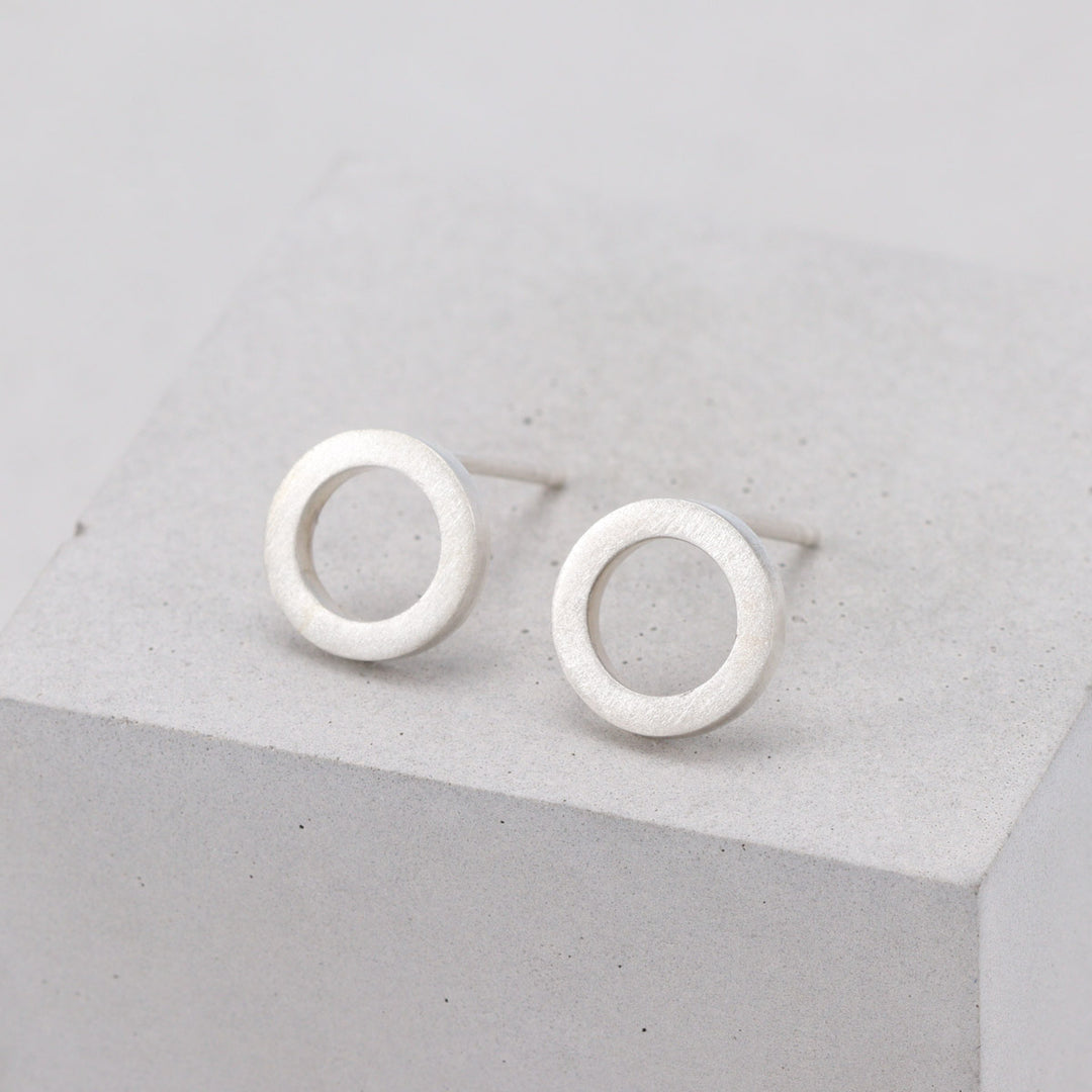 Brushed sterling silver circular stud earrings