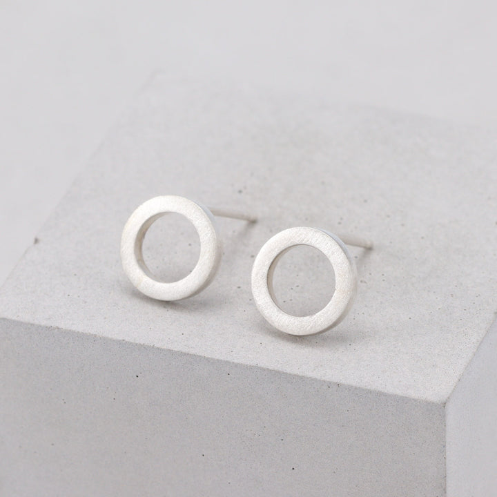 Brushed sterling silver circular stud earrings