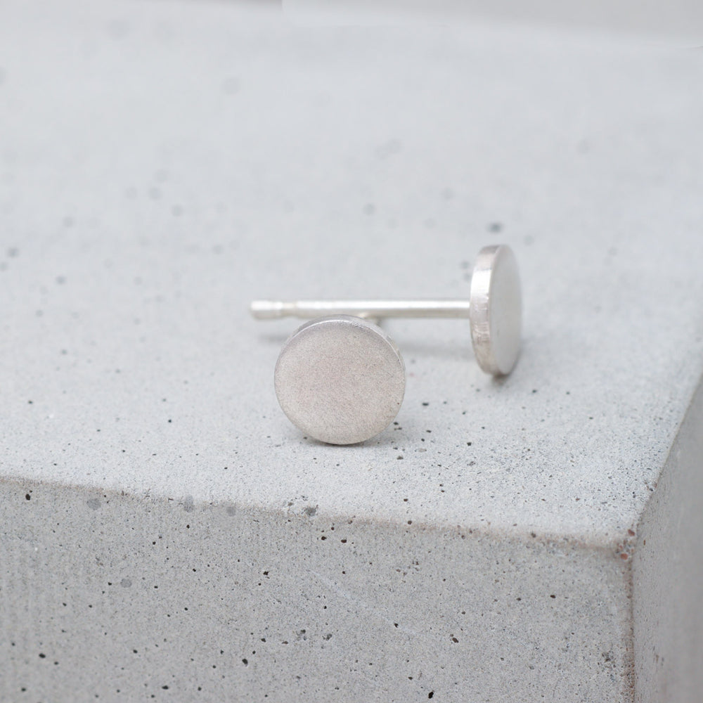 Frosted sterling silver circle stud earrings side