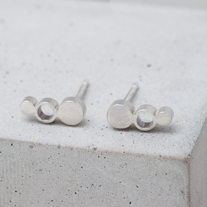 Geometric sterling silver circle stud earrings front