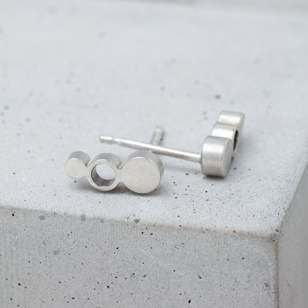Geometric sterling silver circle stud earrings side