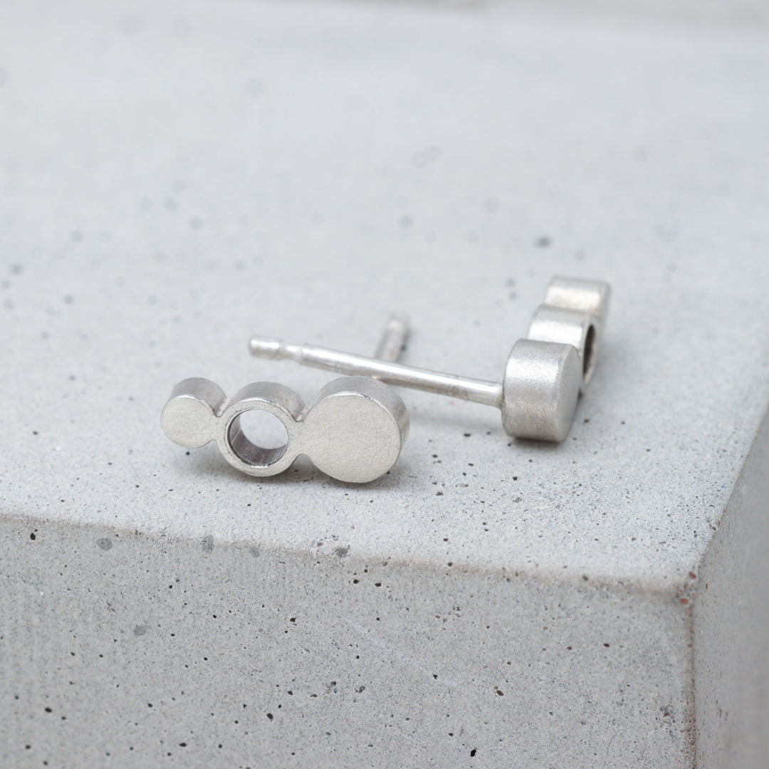 Geometric sterling silver circle stud earrings side