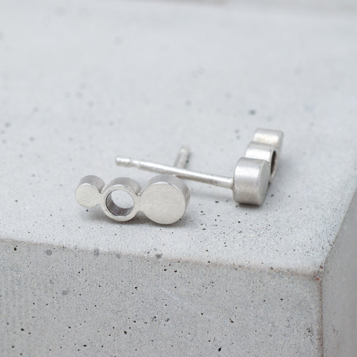 Geometric sterling silver circle stud earrings side