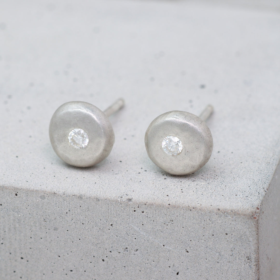 Recycled sterling silver pebble stud earrings set with moissanite