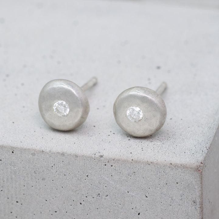 Recycled sterling silver pebble stud earrings set with moissanite