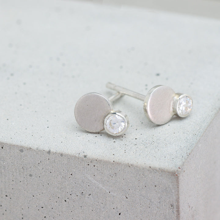 Sterling silver and moissanite circle stud earrings side