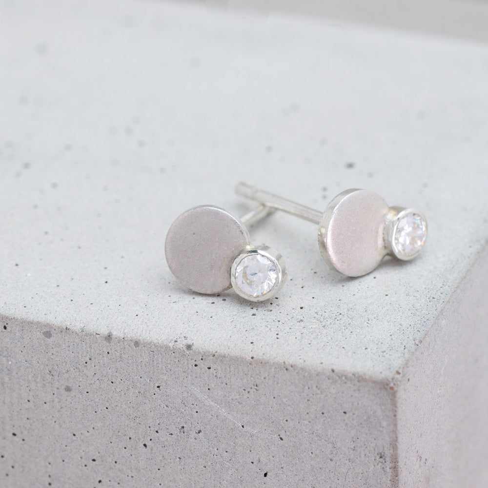 Sterling silver and moissanite circle stud earrings side