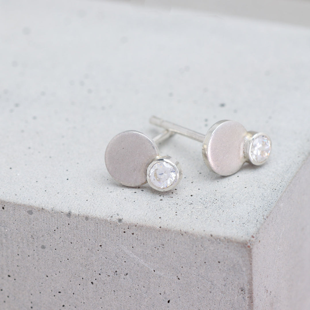 Sterling silver and moissanite circle stud earrings side