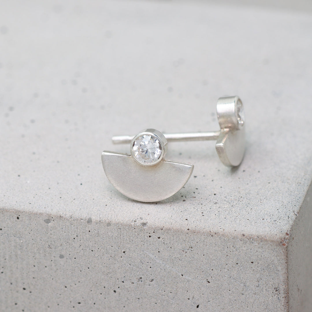 Sterling silver and moissanite half circle stud earrings side