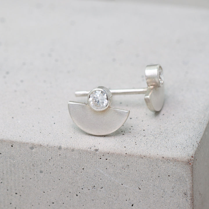 Sterling silver and moissanite half circle stud earrings side