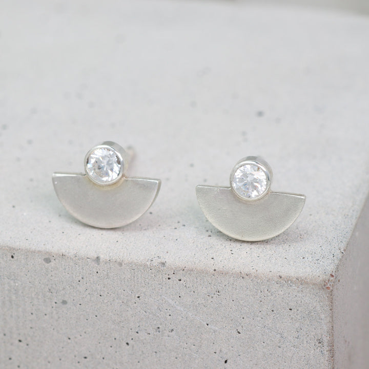 Sterling silver and moissanite half circle stud earrings