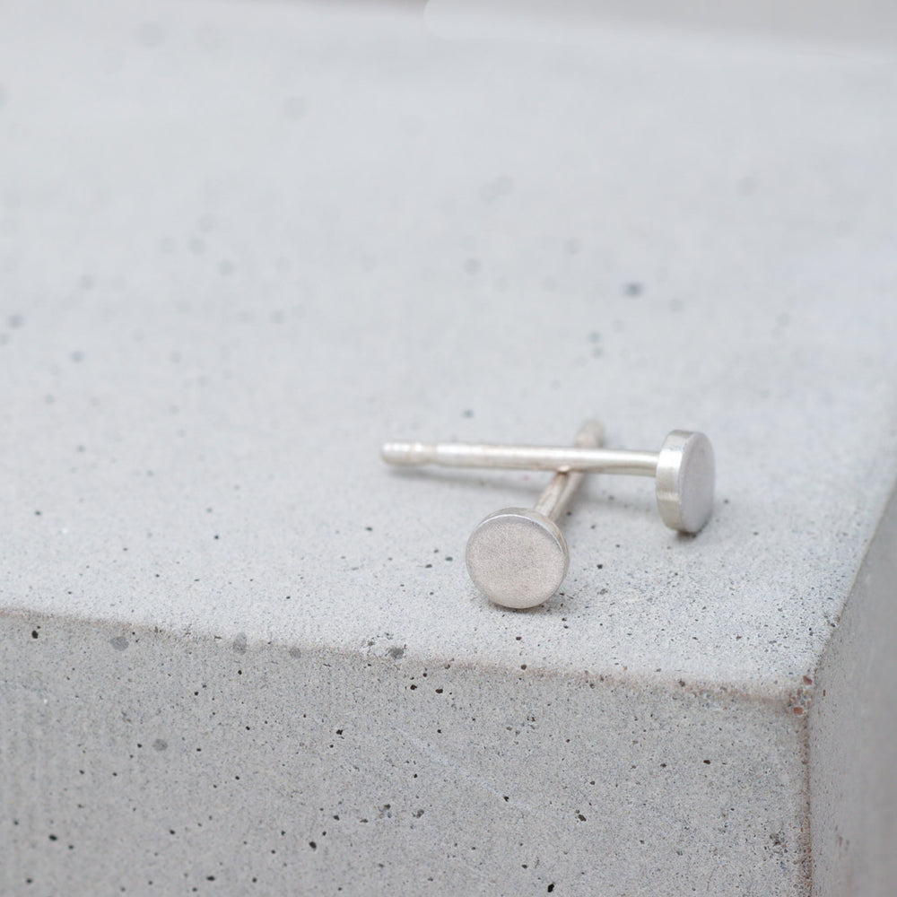 Tiny 3mm frosted sterling silver circle stud earrings side