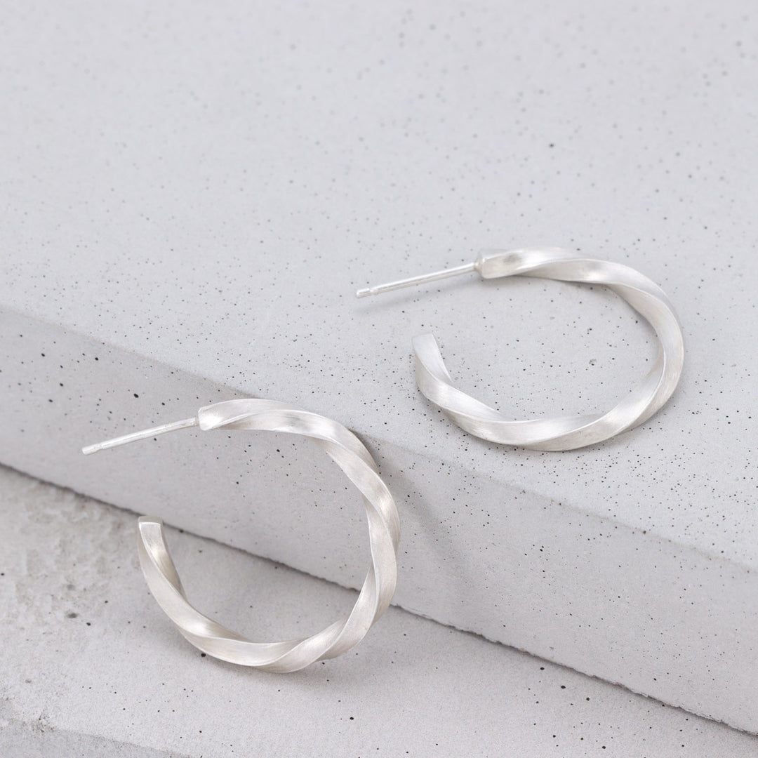rushed sterling silver twisted hoop earrings handmade by Ruth Sims Jewellery