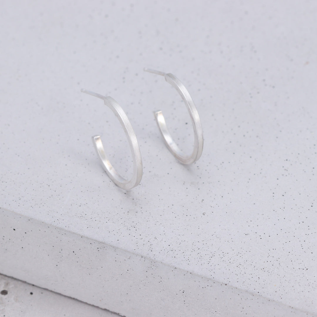 Handmade medium sterling silver hoop earrings with brushed and polished finish