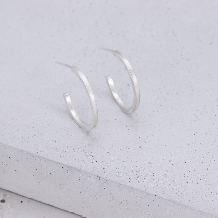 Handmade medium sterling silver hoop earrings with brushed and polished finish